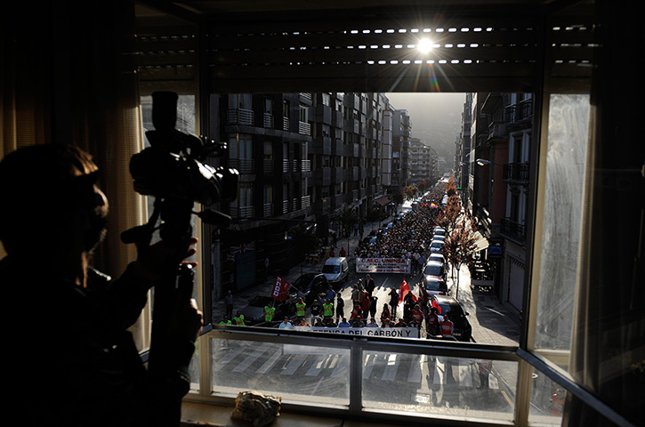 24 hours: Mieres, Spain: A cameraman films a demonstration