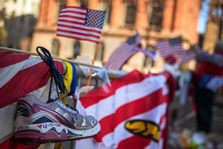 boston service: A jogging shoe is seen at a makeshift memorial