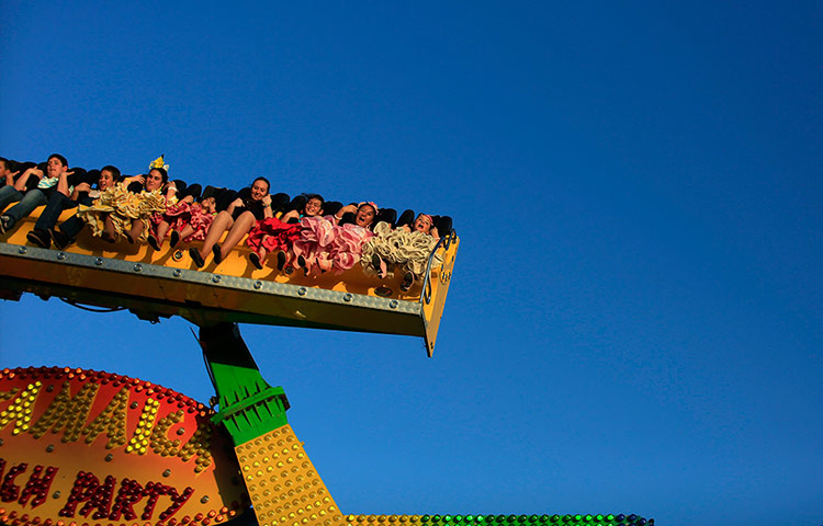 24 hours in pictures: Children on a ride at an amusement park