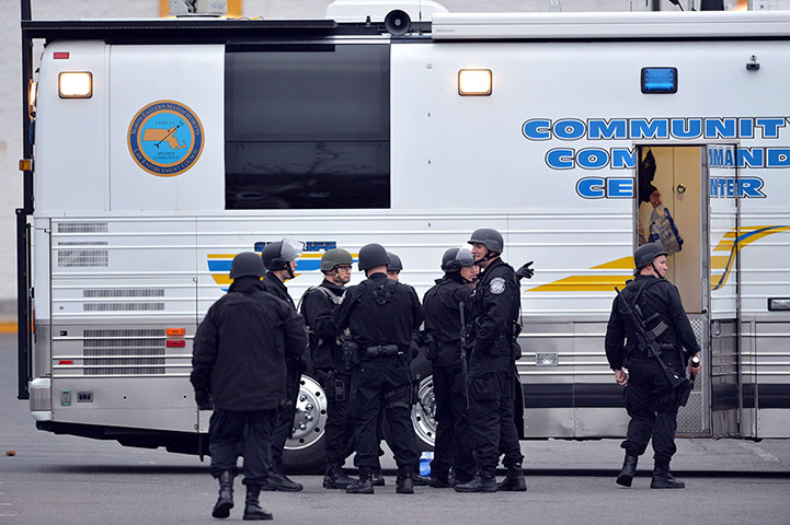 Watertown crime scene: Police officers stand next to a shopping mall