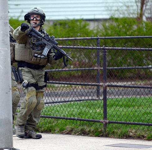 Watertown crime scene: An FBI SWAT team member shouts as his team