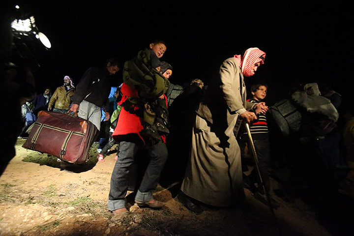Zaatari refugee camp: Syrian Refugees Cross In To Jordan En Route To Zaatari Camp