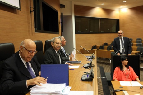 Cyprus's finance ministry permanent secretary Christos Patsalides (background right) starts testifying, Nicosia Friday 19 April 2013, into the economic circumstances leading to the turmoil of an EU sanctioned bailout for the troubled Mediterranean island.