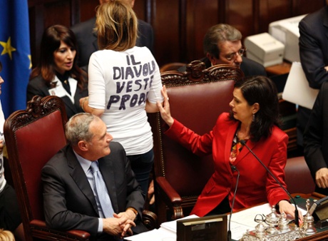 Lower house president Laura Boldrini (R) checks the t-shirt of PDL (People of Freedom party) member Alessandra Mussolini (C) during the second day of the presidential election in the lower house of the parliament in Rome April 19, 2013.