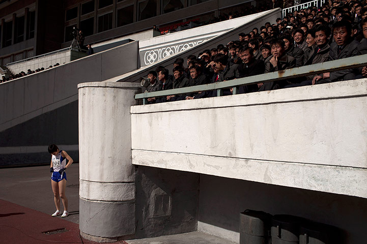 20 Photos: A marathon runner prepares at Kim Il-sung Stadium in Pyongyang, North Korea