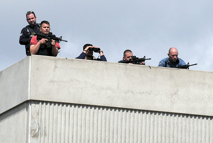 boston lockdown: Snipers take positions on a rooftop duri