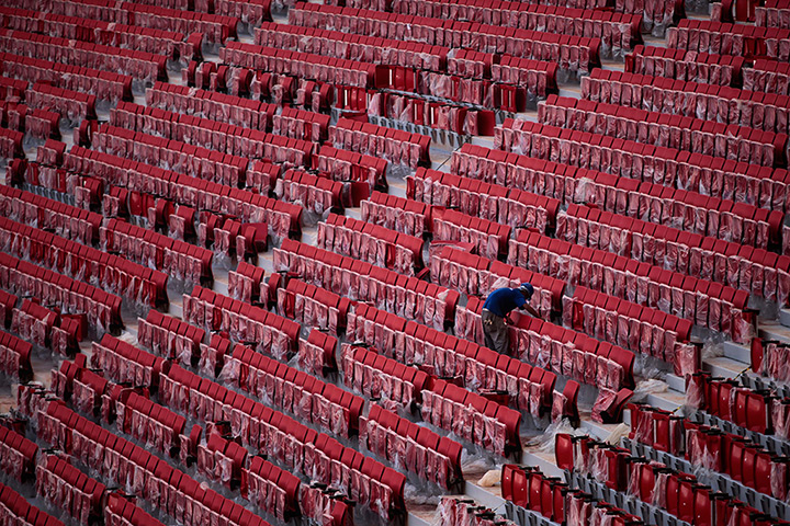 24 hours in pictures: Brasilia, Brazil,: An employee works on the reconstruction of the National 