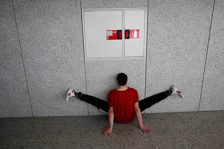 24 hours in pictures: Madrid, Spain: A dancer stretches before taking part in an audition for Dan