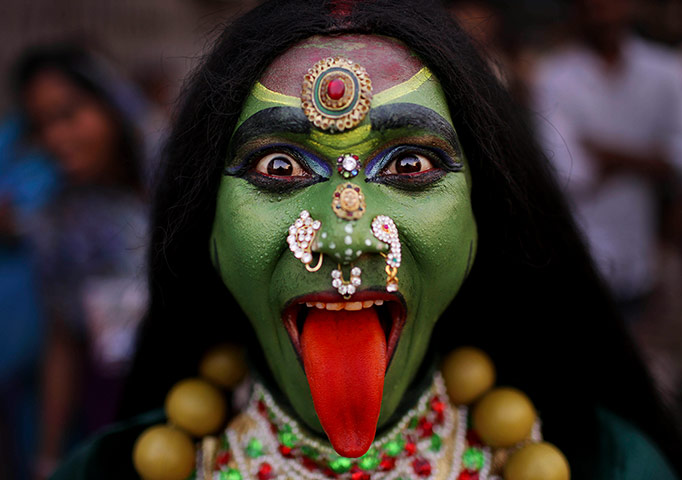 24 Hours: An Indian man dressed as Hindu Goddess Kali during the Ram Navami festival