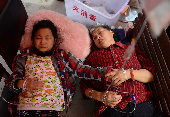 China: Injured people receive treatment at temporary medical tents in Baosheng 