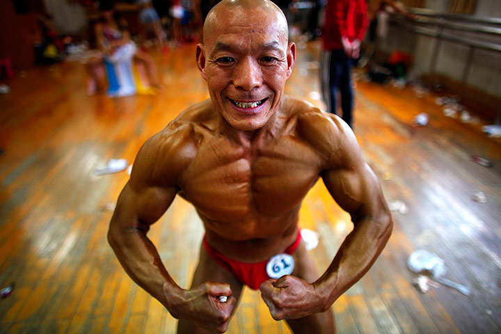 24 hours: Feng Qing Yu, 61, prepares to compete in a bodybuilding competition in Shao