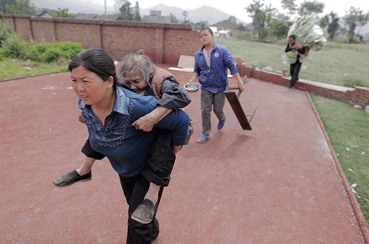 Dan Chung in China: A woman called Mrs Zhang carries her elderly neighbour Tan Xuelan to a temp