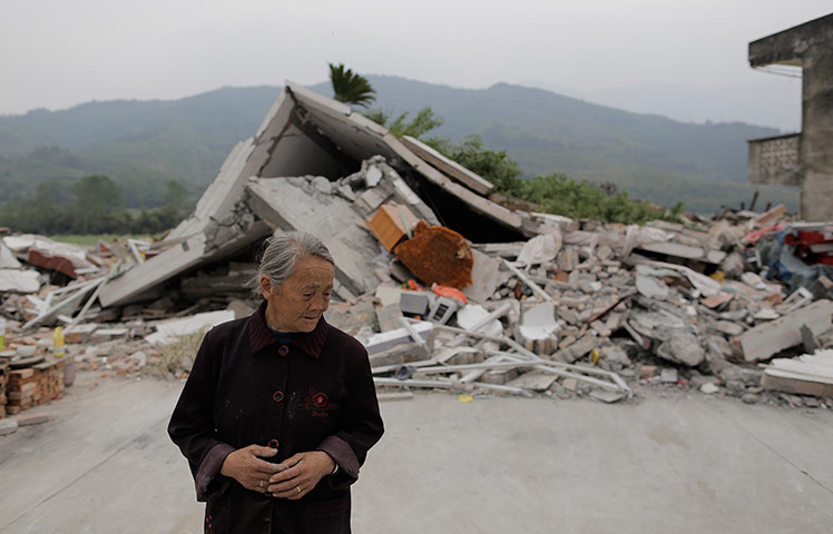 Dan Chung in China: Gao Shizhen stands in front of the house where her daughter in law died.
