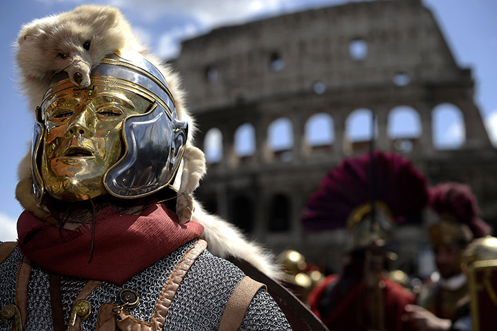The birth of Rome: Men belonging to historical groups march dressed as ancient Romans 