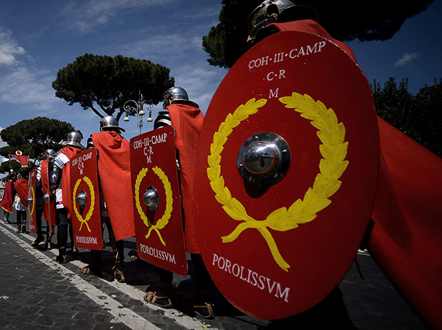 The birth of Rome: Men belonging to historical groups march