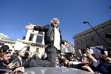 Five-Star Movement's leader Beppe Grillo on the roof of a car in Rome, Italy, 21 April 2013.