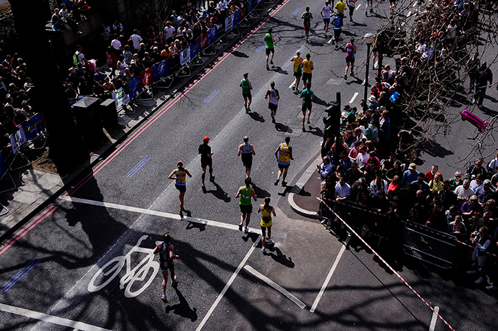 London Marathon: Runners pass under Waterloo Bridge along the Embankment