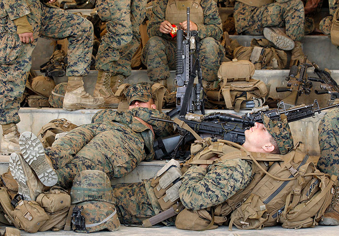 24 hours in pictures: US Marines take a rest during a training exercise