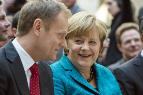 German Chancellor Angela Merkel and Polish Prime Minister Donald Tusk talking before the conference.