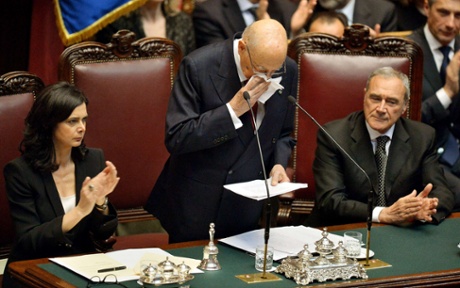 Re-elected Italian President Giorgio Napolitano (C) addresses deputies and senators next to Laura Boldrini (L), president of the Italian Parliament and Pietro Grasso, president of the Italian senate, at the Italian Parliament in Rome on April 22, 2013.