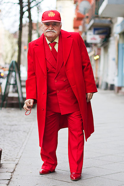 big picture - what ali : man wearing red coat and suit and baseball cap