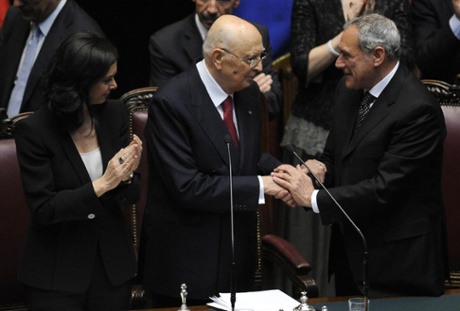 Giorgio Napolitano (C) is applauded by Chamber of Deputies president Laura Boldrini (L), while being congratulated by Senate president Pietro Grasso (R), at the Italian parliament in Rome, 22 April 2013.