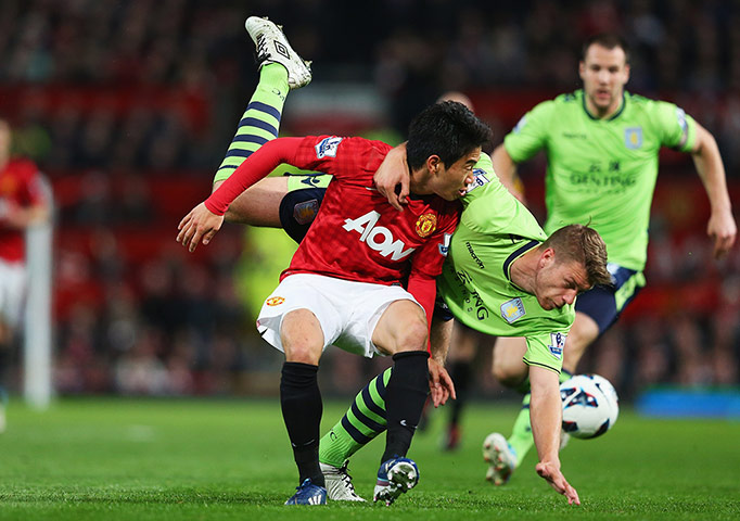 United v Villa 2: Shinji Kagawa tussles with Nathan Baker