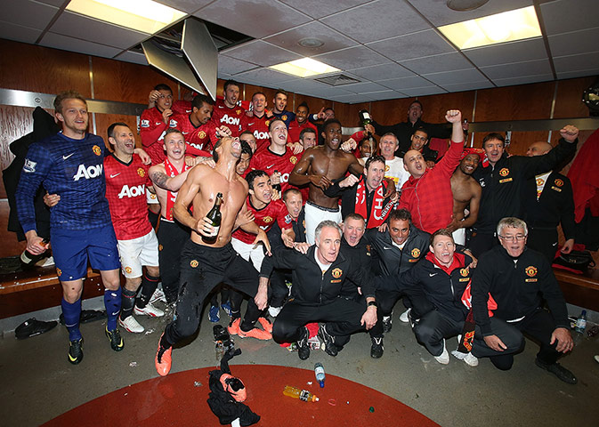 United v Villa 2: Manchester United players and staff celebrate in the dressing room
