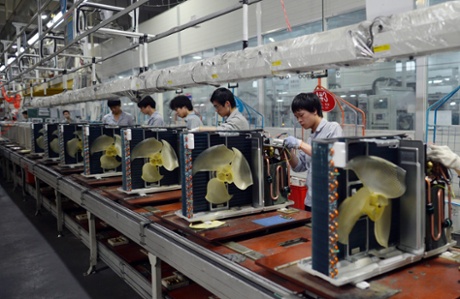 Workers assembling air conditioners at a factory of Gree Electric Appliances in Wuhan in central China's Hubei province 18 April 2013.