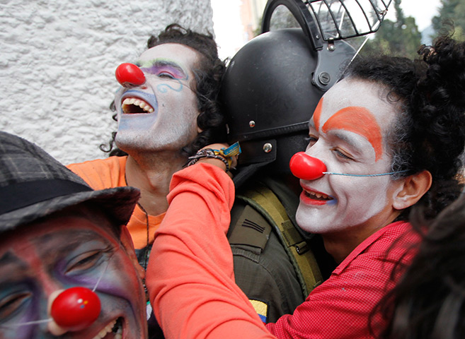 24 hours in pictures: Students hug a policeman in Bogota