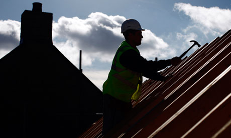 Builder on a house roof