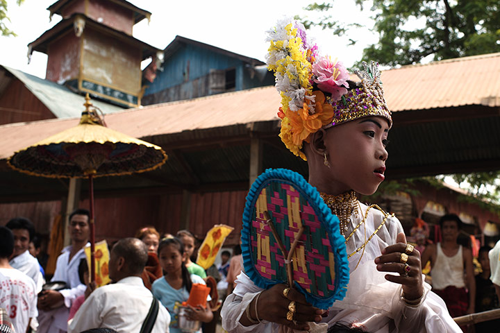 Theravada initiation: Saw Win Gy holds fan
