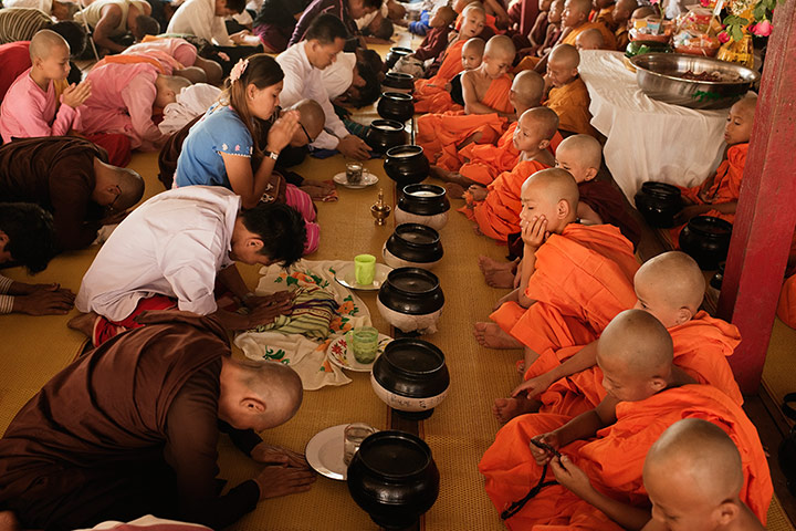 Theravada initiation: parents bow to children