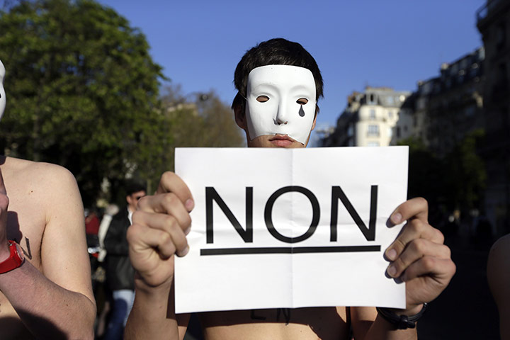 French Gay Marriage: Bear chested men sporting white masks