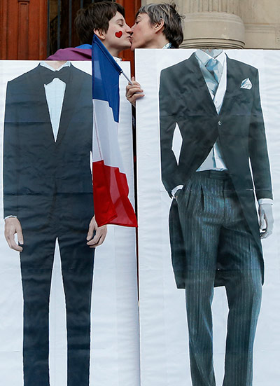 French Gay Marriage: Pro-gay marriage activists pose during a gathering at Paris 4th district ci