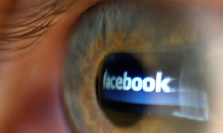 Facebook logo reflected in eye
