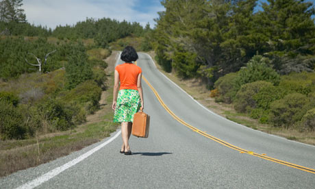 Woman walking down road