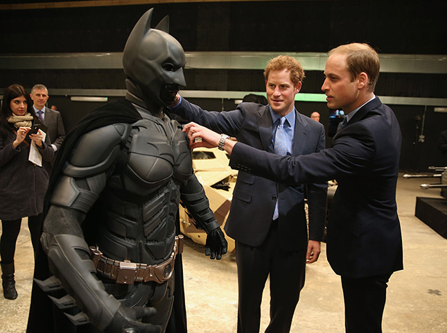 Royal Warner Bros: Prince William and Prince Harry look at a 'Batsuit' 