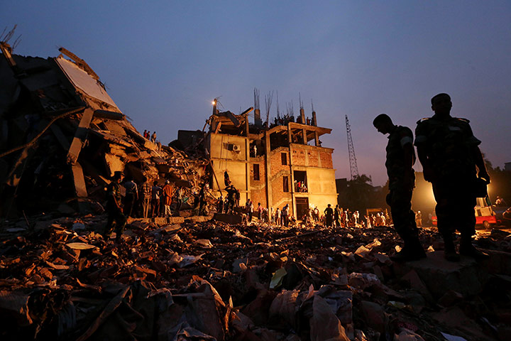 20 Photos: Bangladeshi soldiers stand in the rubble as rescuers continued to search