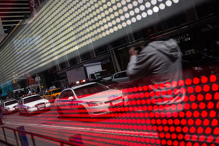 20 Photos: Police vehicles reflected in an electronic US flag in New York