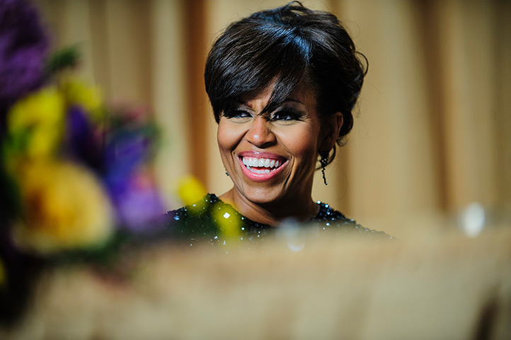 White House dinner: First lady Michelle Obama reacts to a joke told by Conan O'Brien