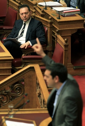 Greek Finance Minister Yannis Stournaras (L) watch main opposition Radical Left Coalition (SYRIZA) leader Alexis Tsipras (R) who speaks during a debate in the Greek Parliament, in Athens, Greece, 28 April 2013.