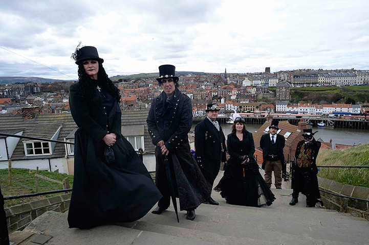 whitby goth festival: Goths climb the steps to Whitby Abbey, which overlooks the town