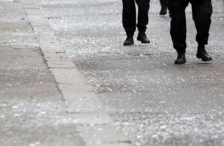 Prague explosion: Police officers walk over shattered glass