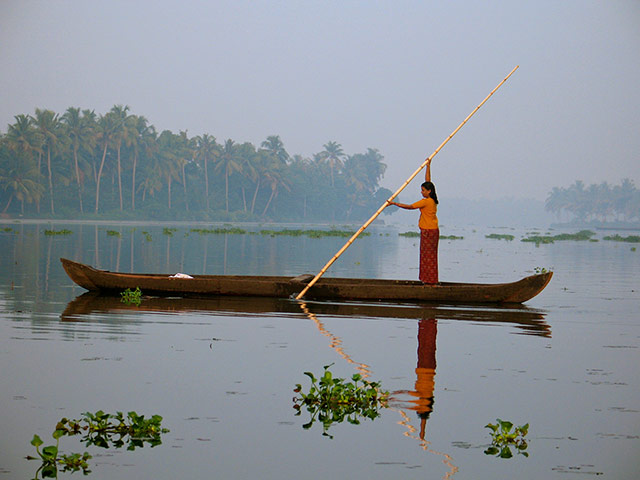 Your Pictures - Crossings: asian woman in canoe with pole in lake