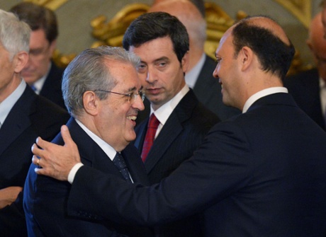 Italian deputy Prime Minister and Interior Minister Angelino Alfano (R) cheers with Economy and Finance Minister Fabrizio Saccomanni (L) at the end of the swearing in ceremony of the new government at the Quirinale Palace in Rome on April 28, 2013.