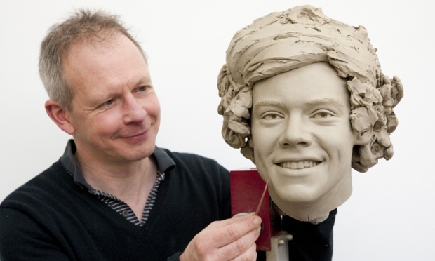 A Hairy Stylist at work for Madame Tussauds putting the finishing touches to someone called Harry Styles of One Direction. The new dummies will be on show in London on April 14th.