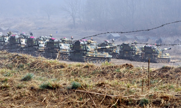 Meanwhile, South Korean marine's K-55 self-propelled howitzers are seen over barbed wire at a military training field in the border city of Paju.