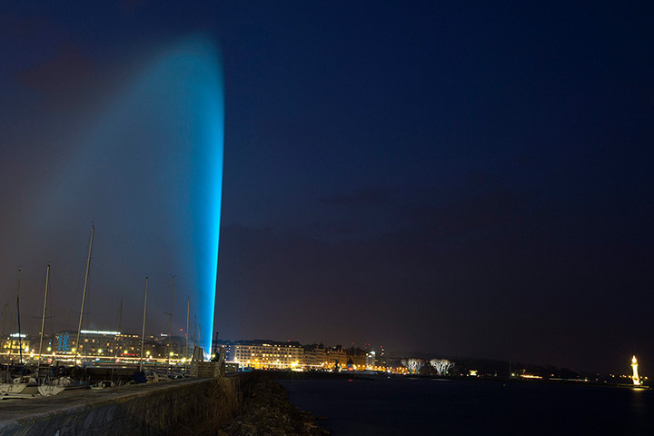 World Autism Day: The water fountain Jet d'eau is illuminated by blue lightsin Geneva, Switze