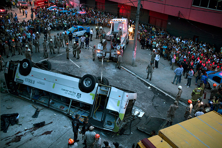 24 hours: Rio de Janeiro, Brazil: A bus lies upside down
